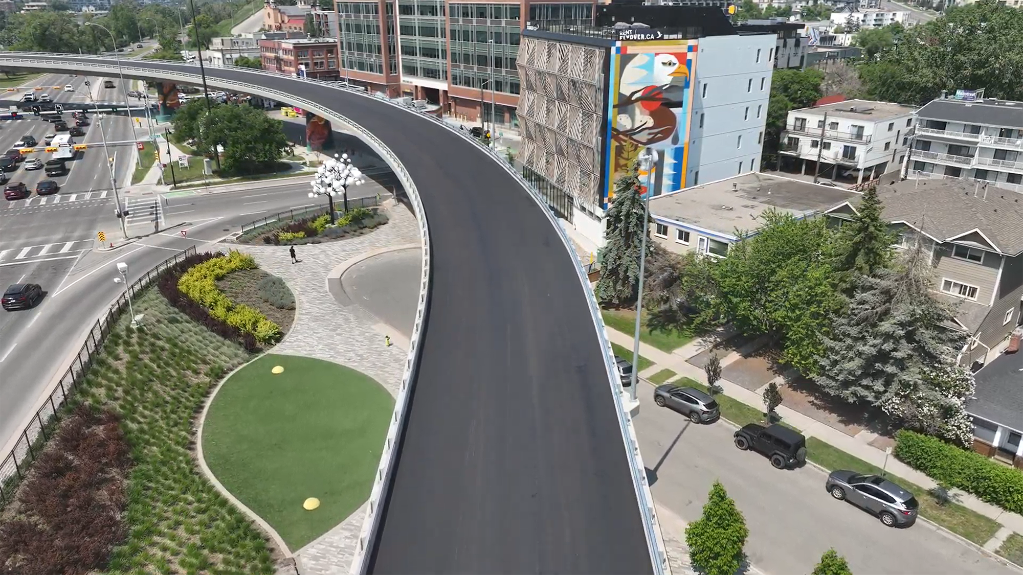 A newly re-paved flyover running through a city