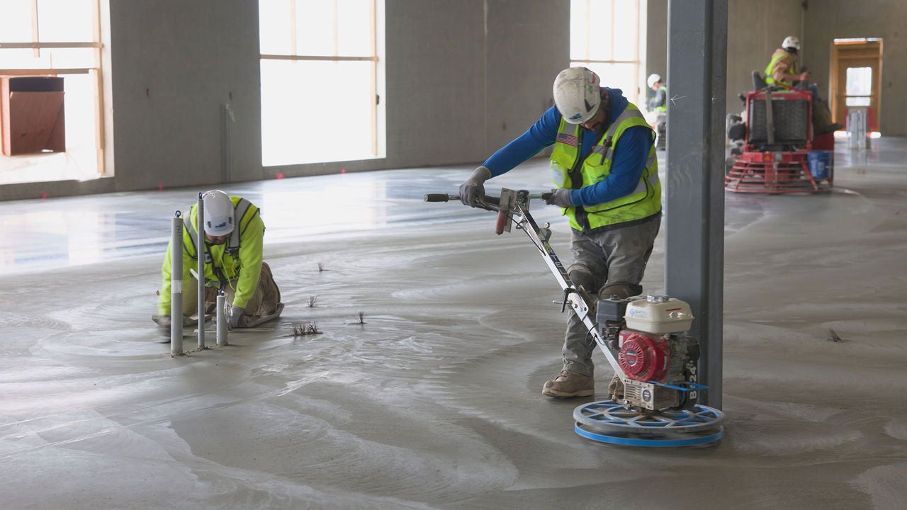 On-site construction team finishing the interior floor of Meta’s Rosemount data center project.