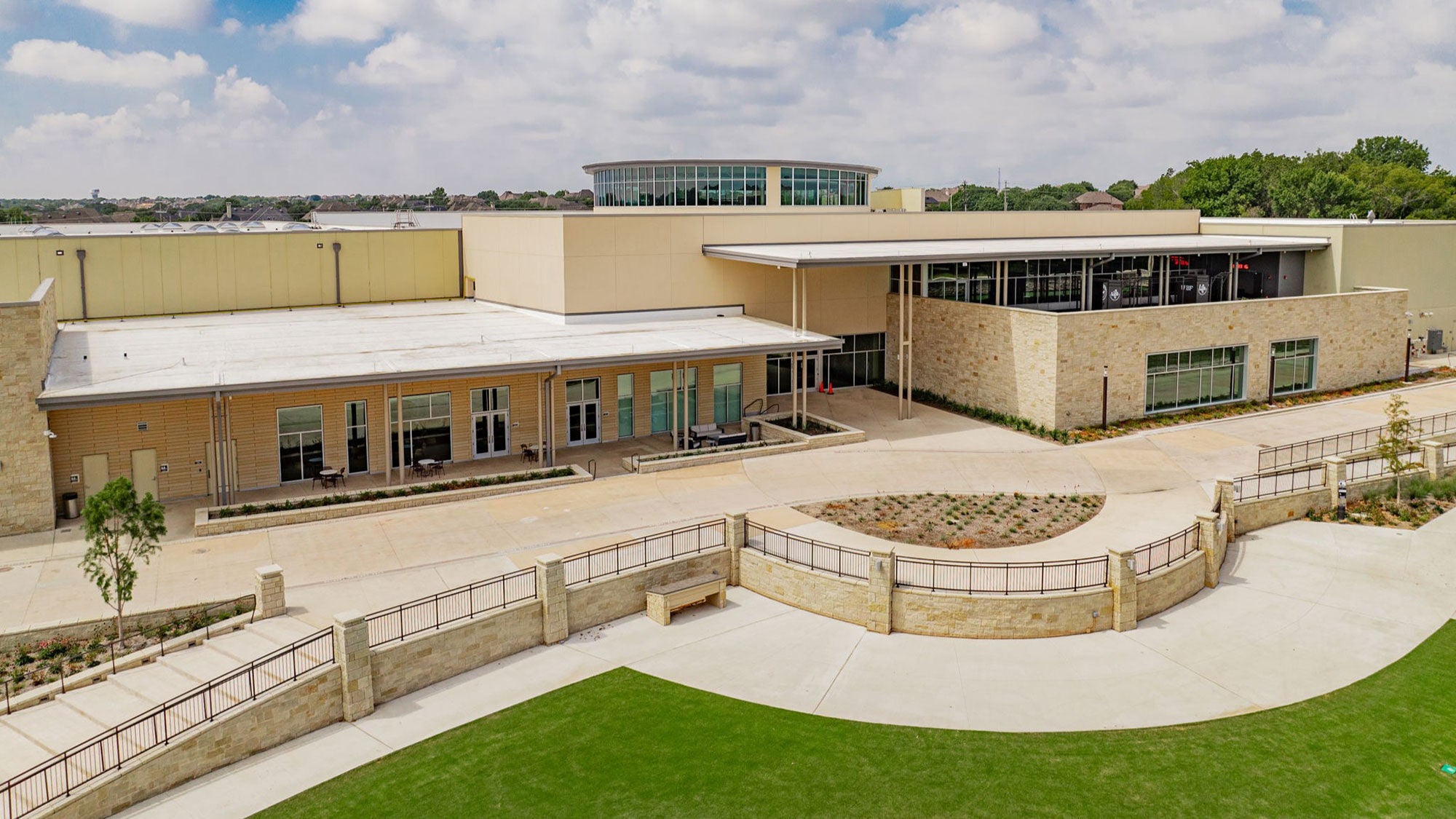 Exterior view of the Allen Terrell Recreation Center with prominent stone hardscaping done by Amrize and modern architectural features.