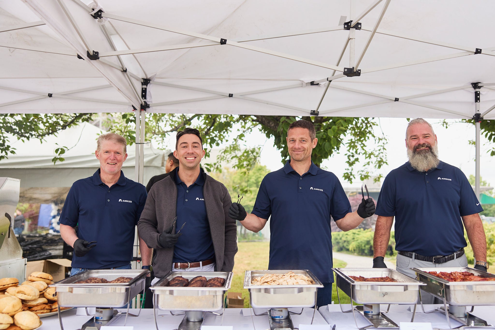 Four men serving food