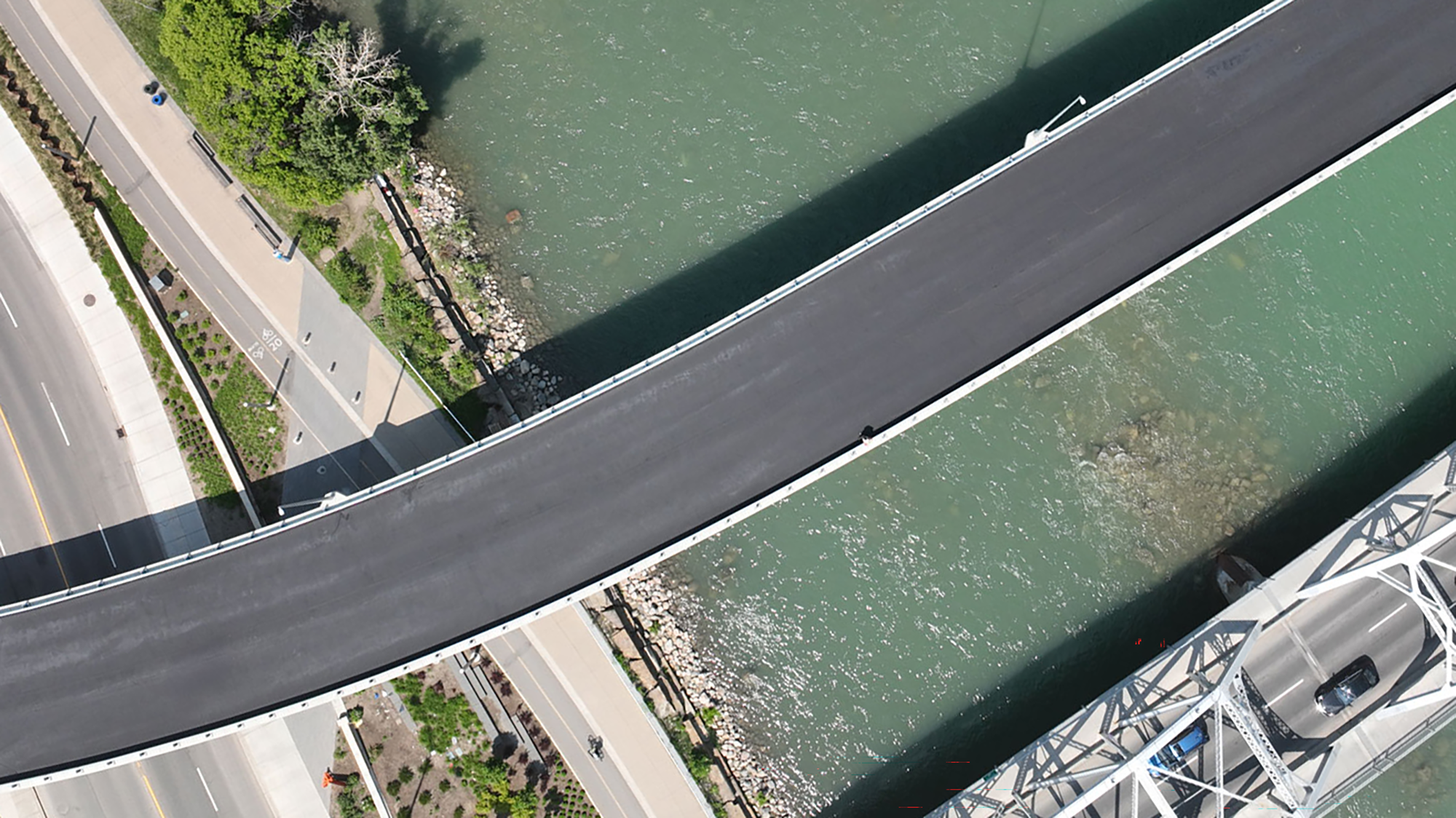 An aerial view of a bridge crossing a river
