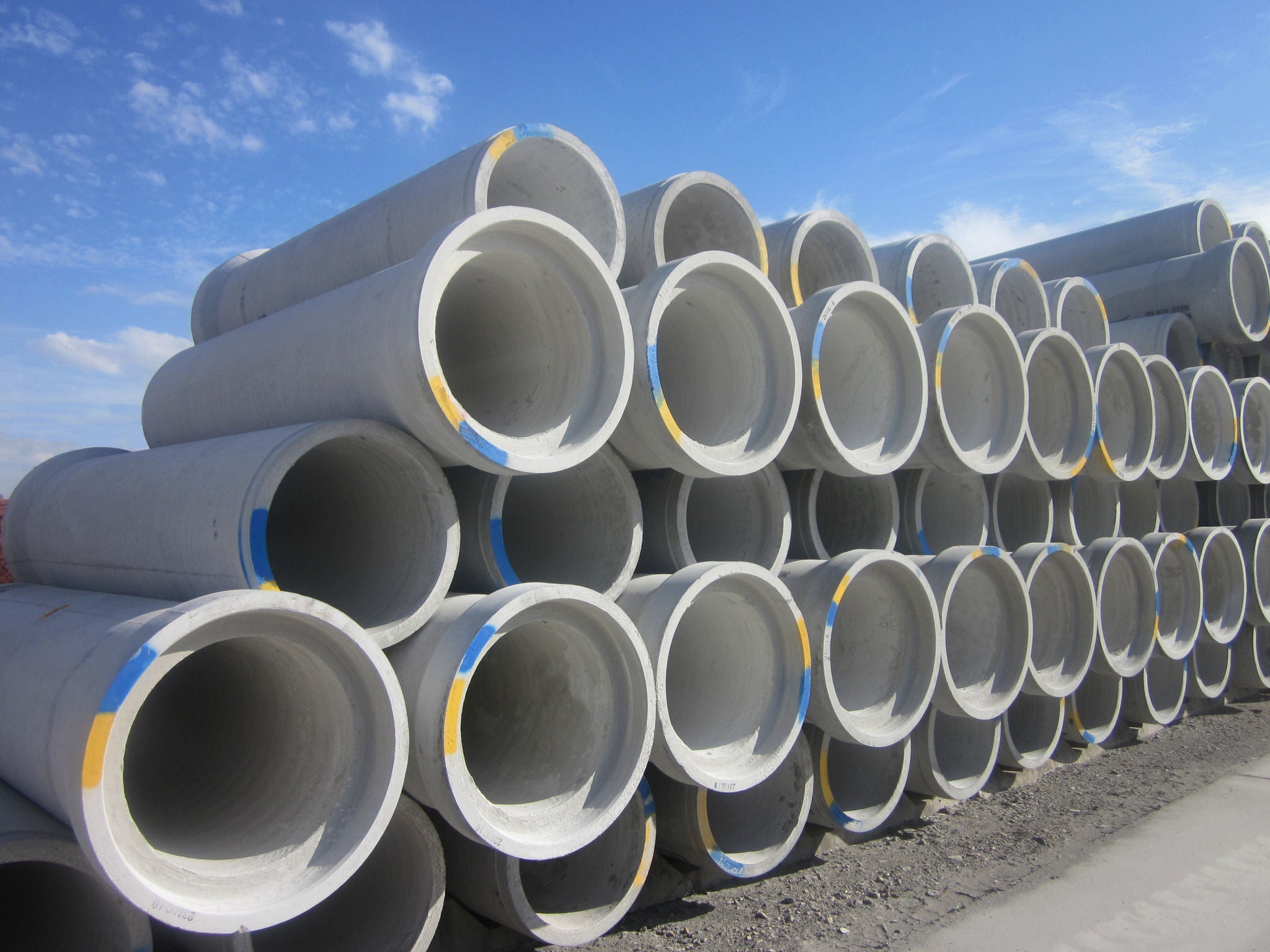 A large stack of precast concrete pipe