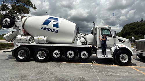 An Amrize-branded concrete mixer as seen from the side