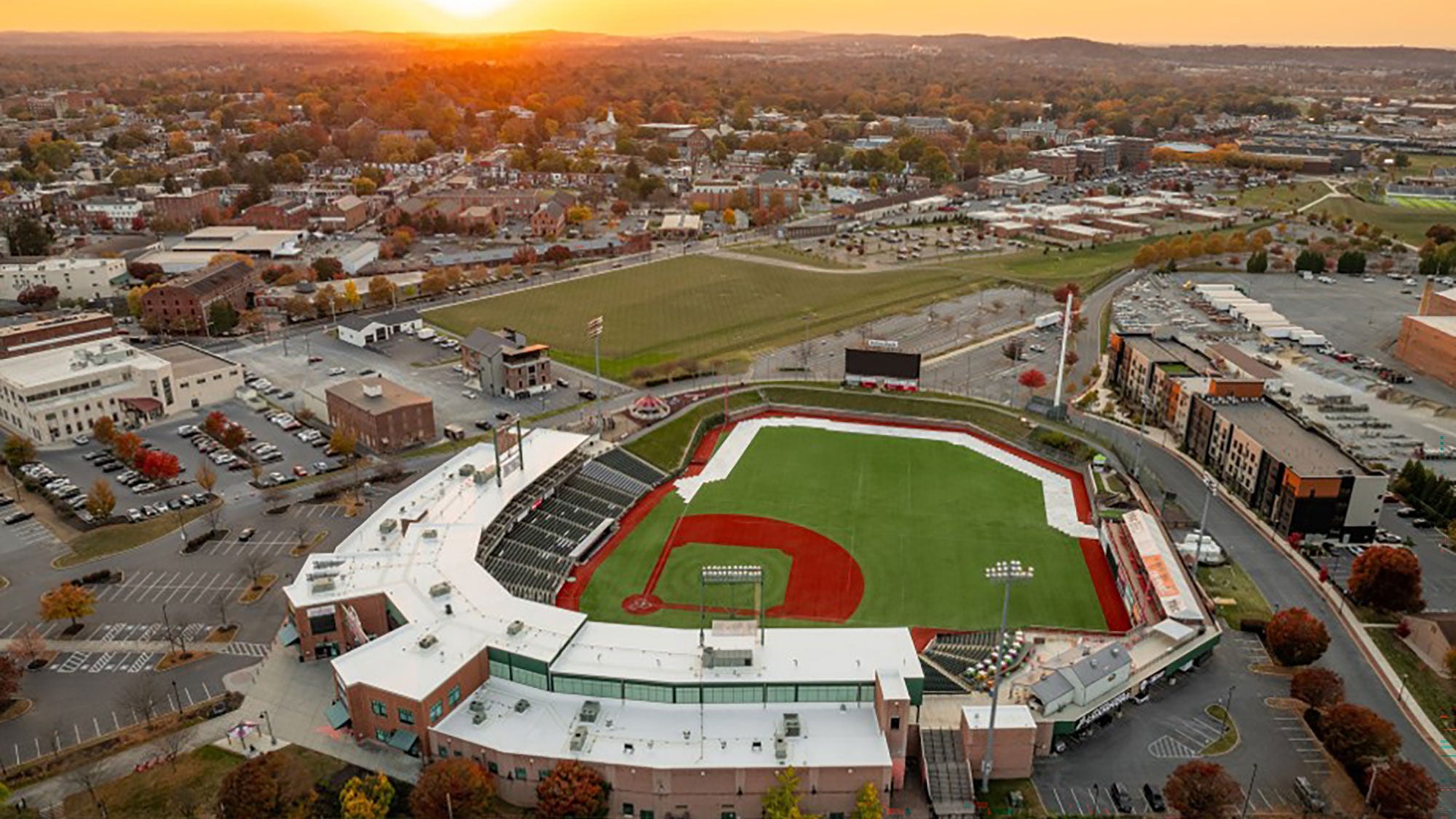 Aerial image of baseball stadium during a sunset. 