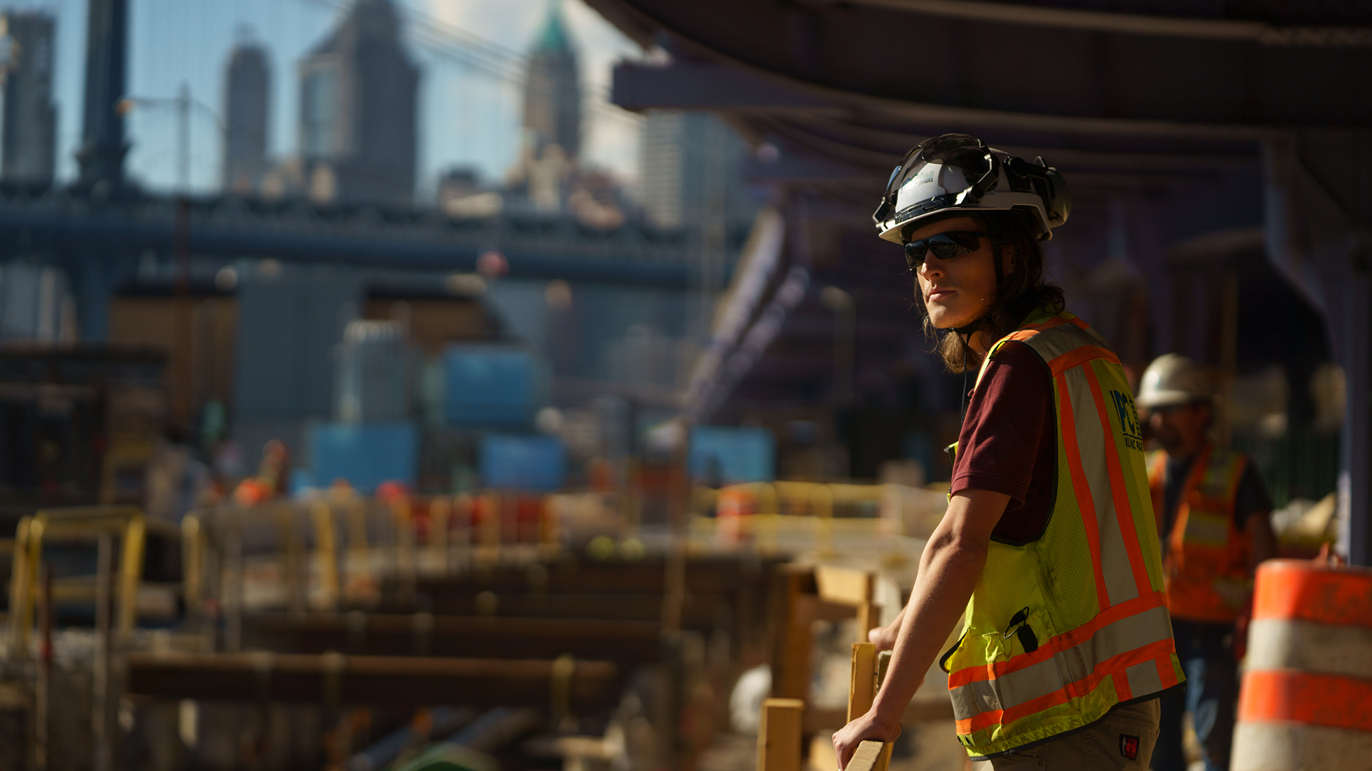 A construction worker looking out over a large building site