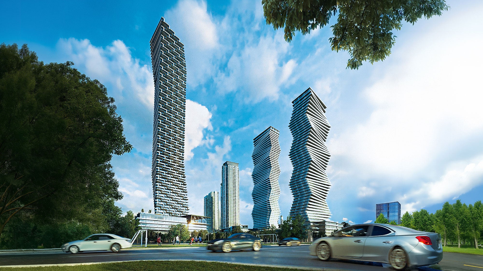 A collection of large geometric towers rising in the middle of an urban landscape