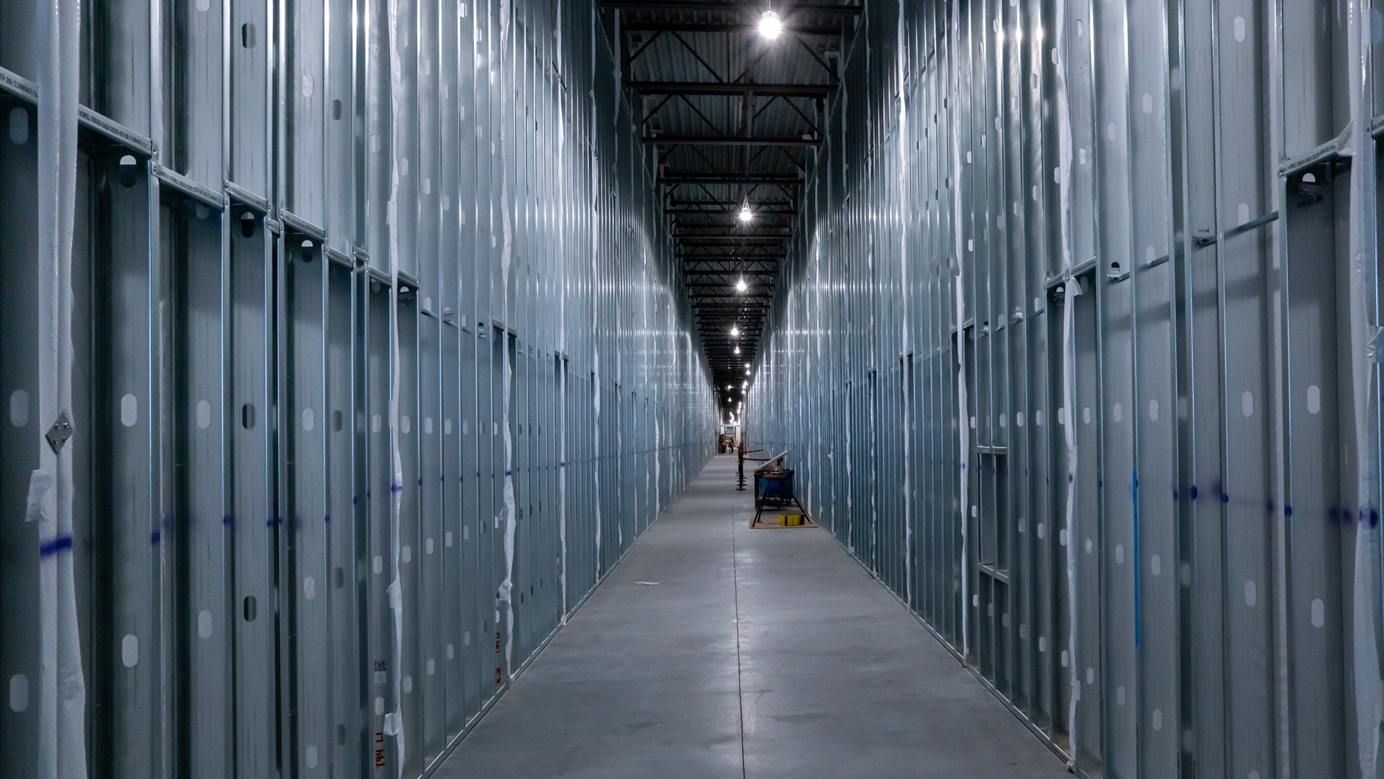 Looking down a corridor inside a data center under construction