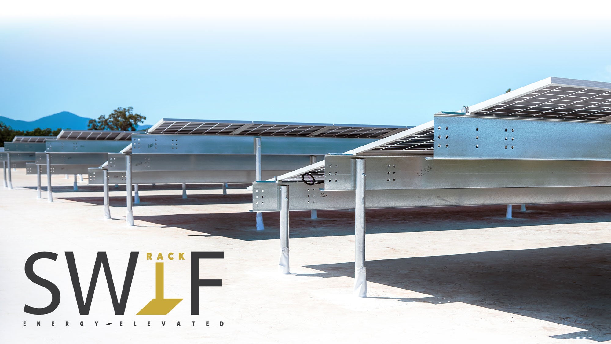 Swif Rack commerical photo featuring three rows of solar panels against a blue clear sky.