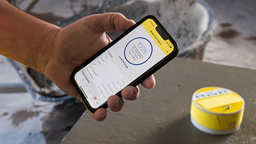 A smart phone with a mobile app open on its screen