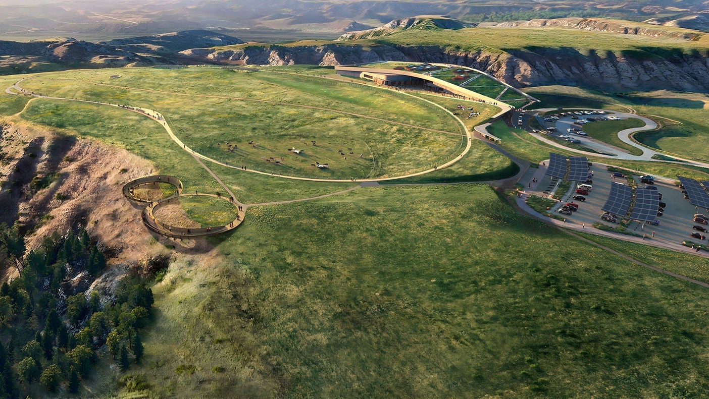 Aerial concept design of the Theodore Roosevelt Presidential Library integrated into expansive grassy plains.