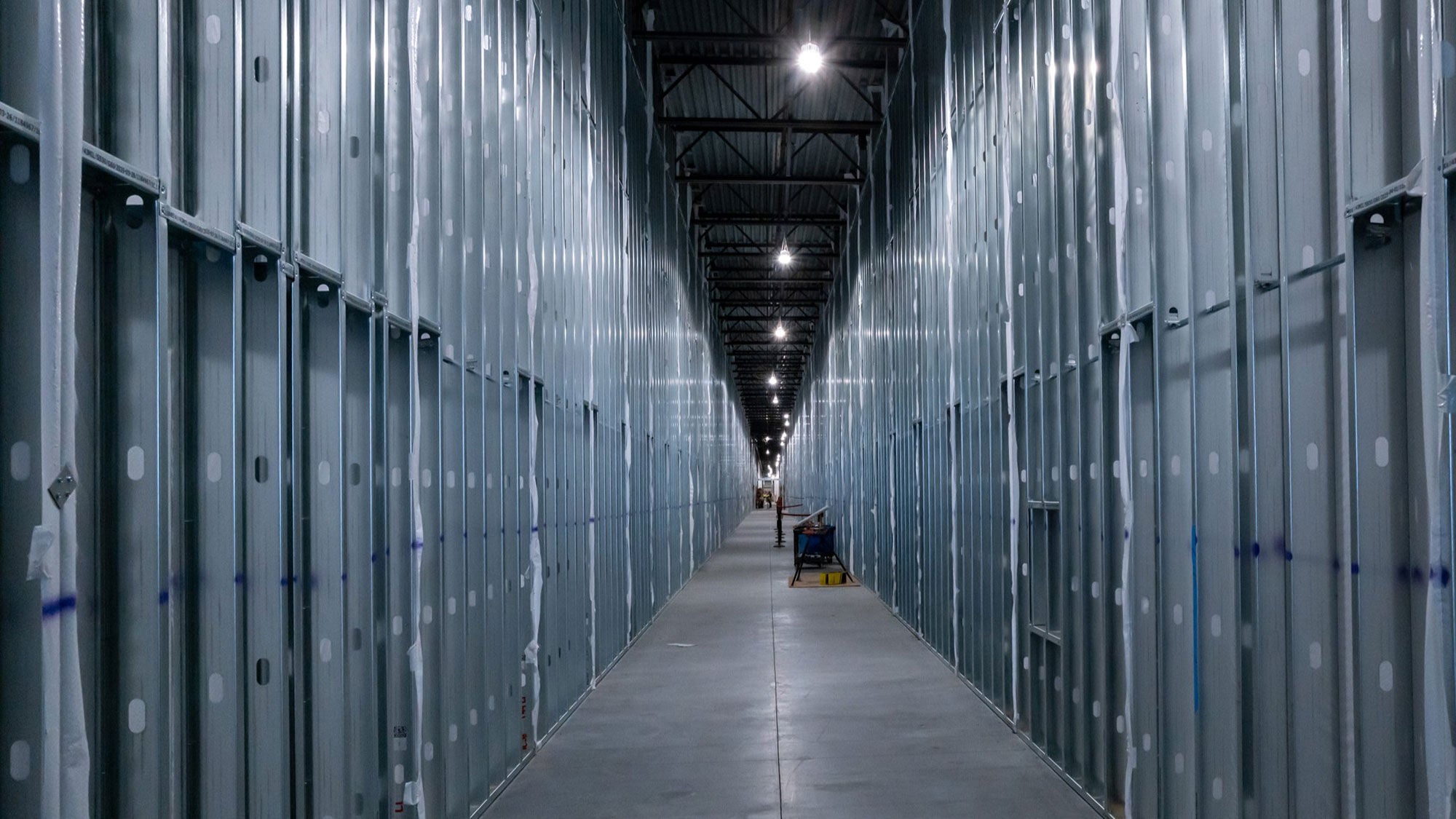 Looking down a corridor inside Meta’s data center under construction.