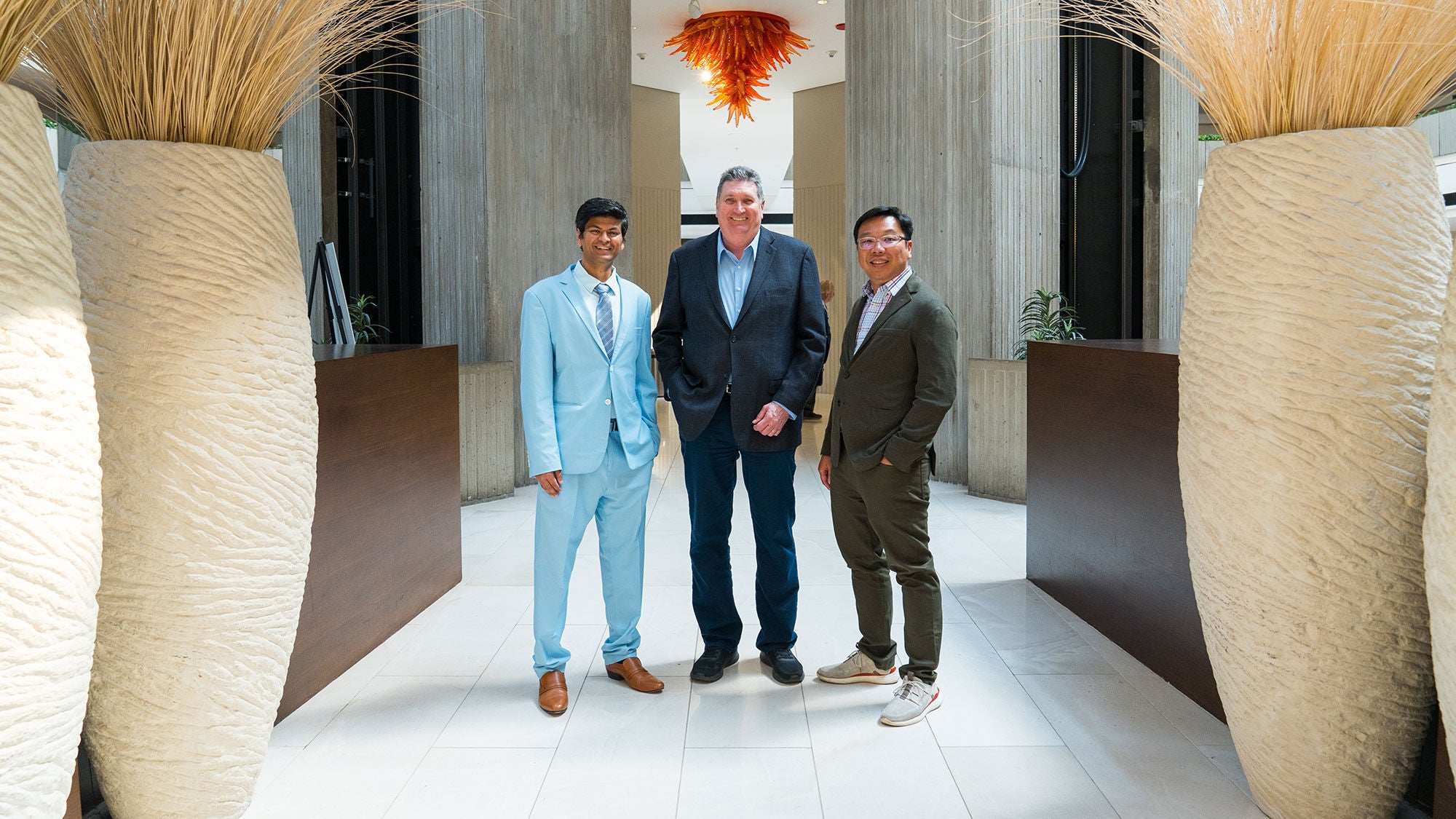 Three researchers from Meta, Amrize and the University of Illinois who partnered on a first-of-its-kind AI-optimized concrete.