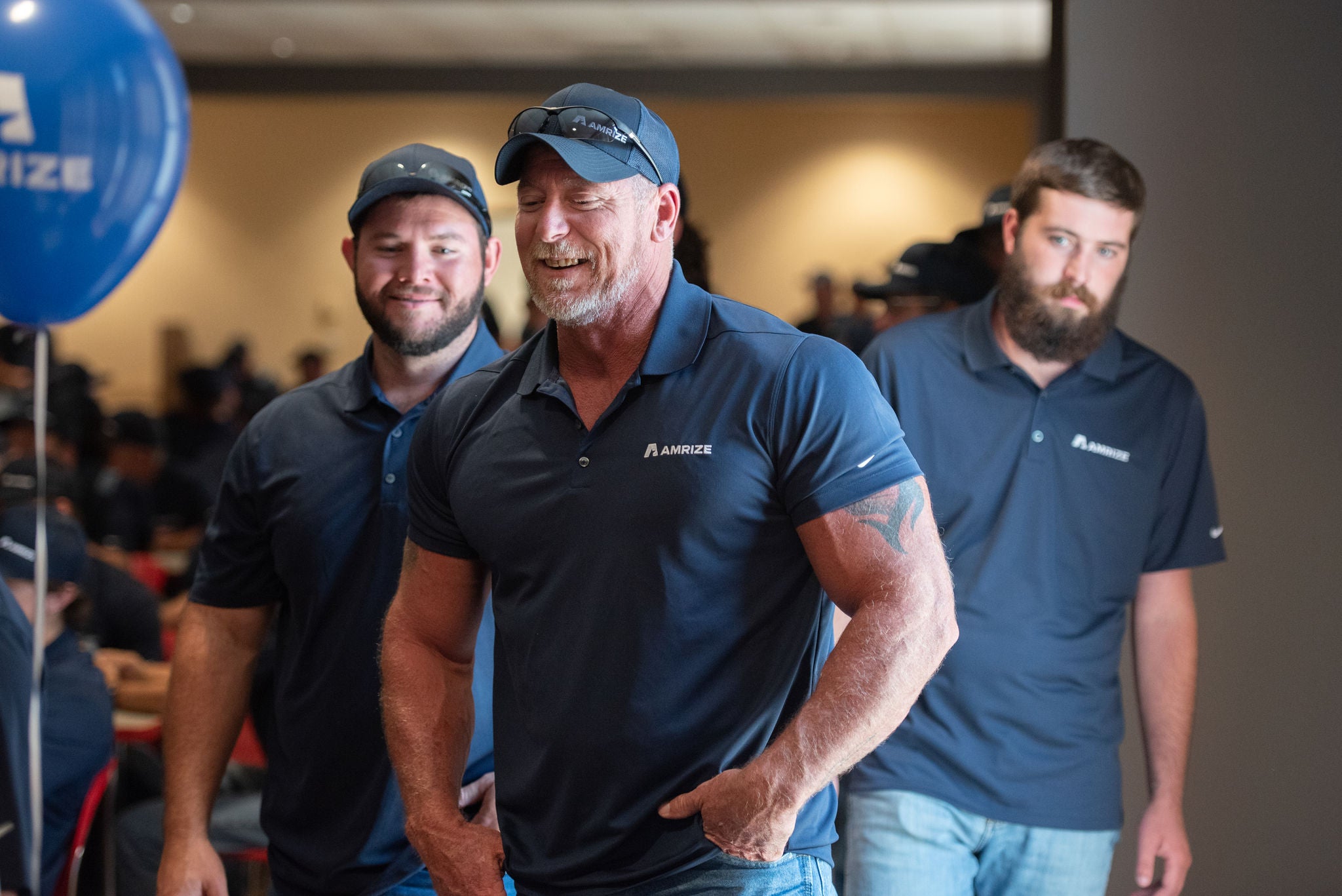 A group of employees smiling