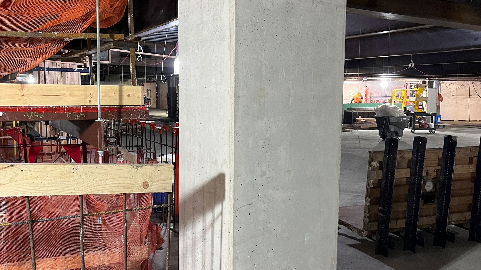 Inside an active construction site depicting a foundational concrete pillar.