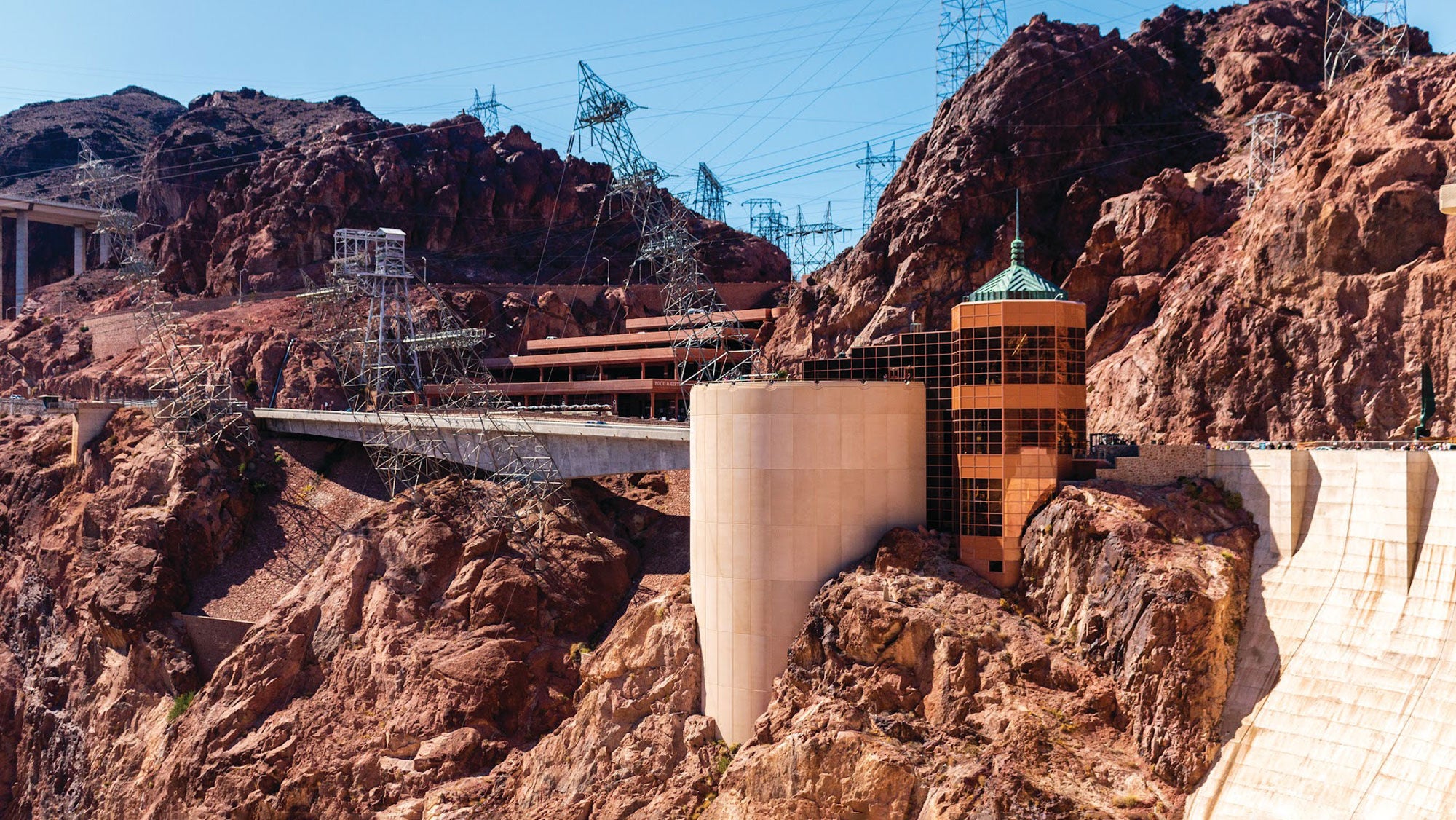 The Hoover Dam Visitor Center, a towering structure built into the side of the canyon next to the Hoover Dam.
