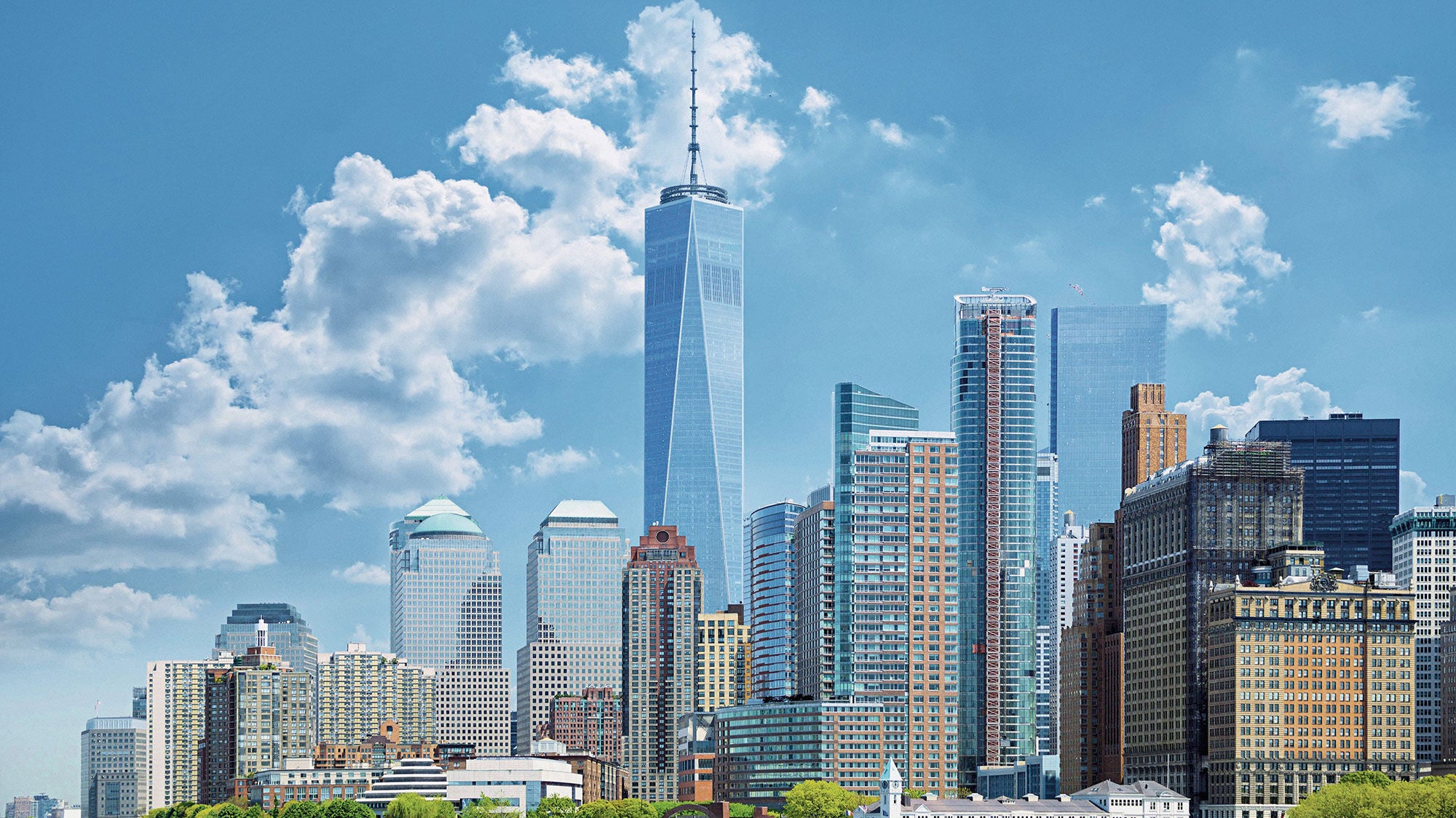 The lower Manhattan skyline, with One World Trade Center rising above the buildings around it.