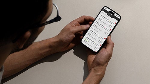 A pair of hands holding a smartphone