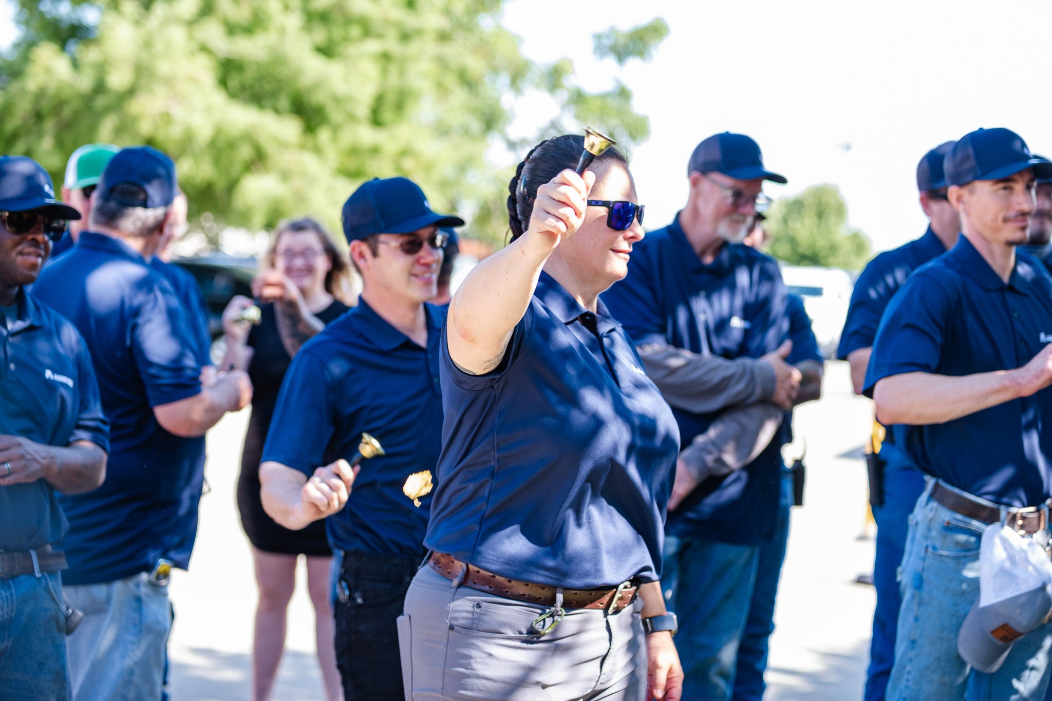A group of employees talking outside